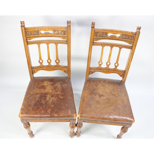 484 - A Set of Six Edwardian Carved Oak Leather Seated Dining Chairs