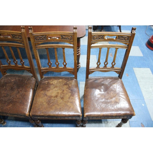 484 - A Set of Six Edwardian Carved Oak Leather Seated Dining Chairs