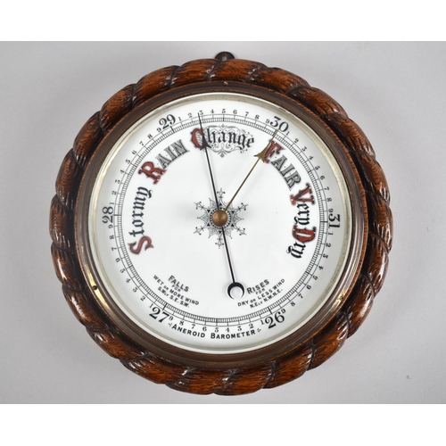 75 - An Edwardian Oak Framed Circular Aneroid Barometer with White Enamelled Dial and Carved Rope Border,... 