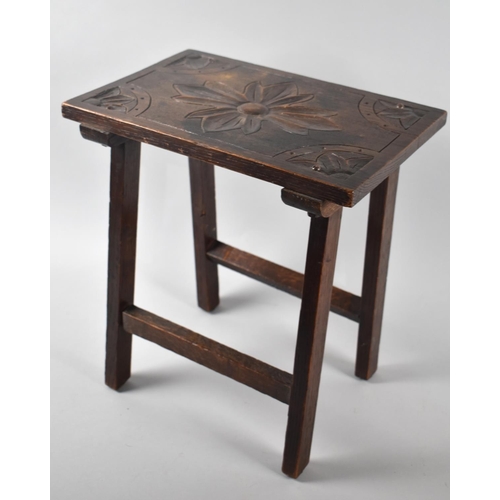 78 - An Edwardian Carved Oak Rectangular Stool, 34cms by 23cms