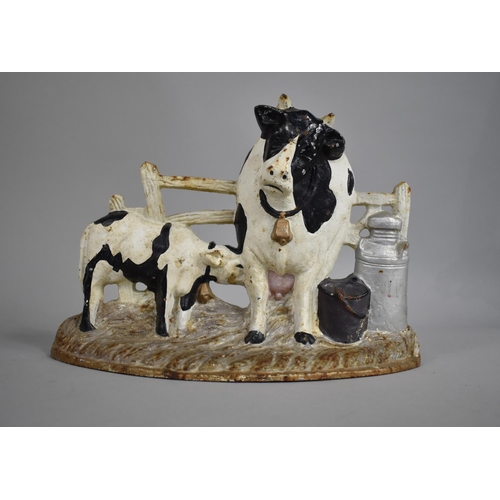 92 - A Modern Cold Painted Cast Iron Door Stop in the Form of Cow Suckled by Calf Next to Churn, 30cms Wi... 