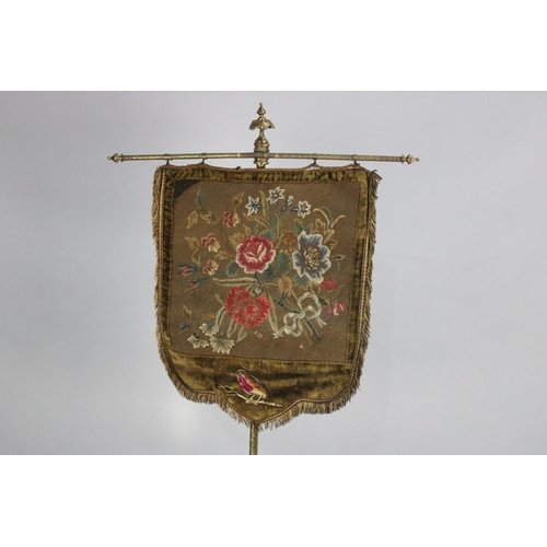 114 - A Late Victorian Gilt Metal Pole Screen with Needlework Tapestry Shield Shaped Banner on Chased Pole... 