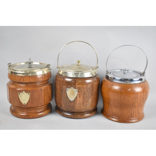 134 - A Collection of Three Mid 20th Century Oak and Silver Plate Biscuit Barrels, 17cm High