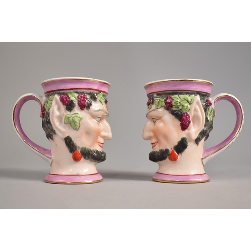 307 - A Pair of Porcelain Bacchanalian Mask Mugs, 10cm high