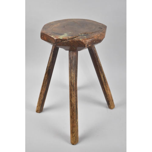 311 - A Primitive Stool on Four Stake Supports, 39cm high