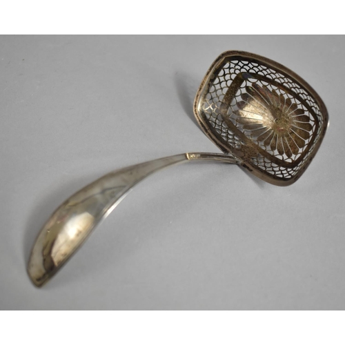 352 - A Continental Silver Sifter Spoon with Pierced Bowl Incorporating Flower Head Motif, 15cm wide