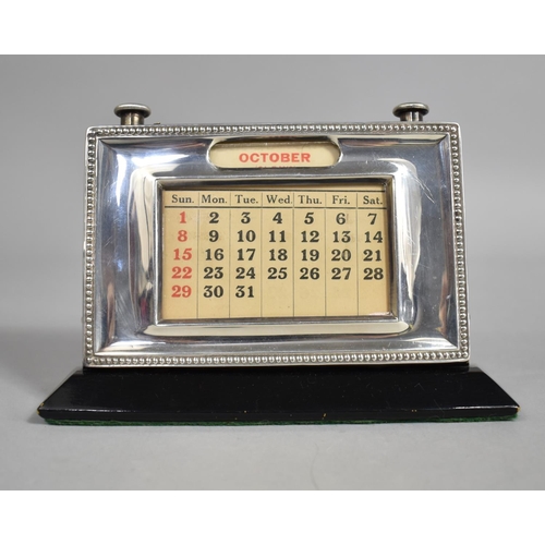 355 - A Silver Mounted Desktop Calendar by W J Myatt & Co, Birmingham Hallmark 1952, 15x10cm high