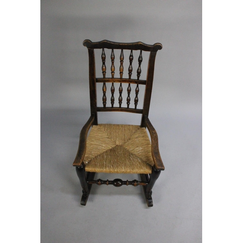 407 - A 19th Century Spindle Back Rush Seated Rocking Chair