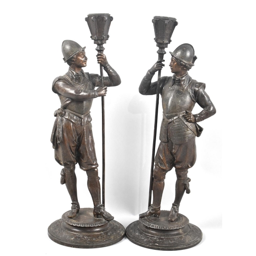 61 - A Pair of Early 20th Century Continental Bronze Effect Figural Candlesticks in the Form of Soldiers ... 