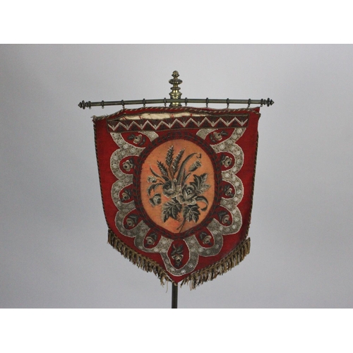 69 - A Victorian Aesthetic Movement Polescreen with Beadwork Shield Shaped Banner Upon Brass Pole Support... 