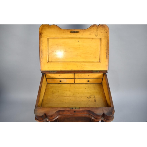 84 - A Late 19th Century Burr Walnut Davenport with Hinged Slope having Tooled Leather Writing Surface to... 