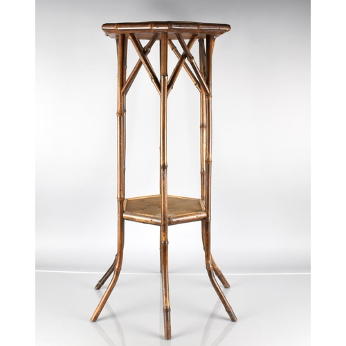 48 - A Late 19th/20th Century Bamboo Rattan Octagonal Stand with Stretcher Shelf, 77cm High