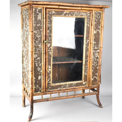 47 - A Late 19th Century/Early 20th Century Bamboo Cabinet with Glazed Door Opening to Three Shelf Inner,... 
