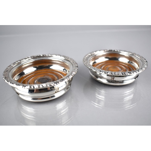 117 - A Pair of 19th/20th Century Silver Plated Coasters with Turned Wooden Bases, Reeded Trim and Stag Cr... 