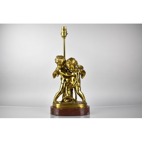 81 - A Bronze Figural Lamp Base Depicting Cupid and Cherubs in Arms on Naturalistic Base and Raised on Ma... 