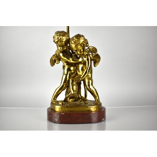 81 - A Bronze Figural Lamp Base Depicting Cupid and Cherubs in Arms on Naturalistic Base and Raised on Ma... 