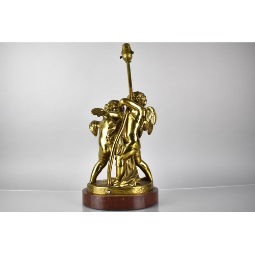 81 - A Bronze Figural Lamp Base Depicting Cupid and Cherubs in Arms on Naturalistic Base and Raised on Ma... 