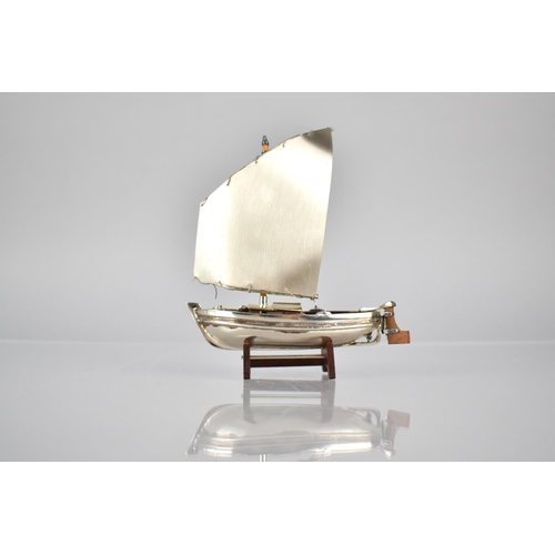 173 - A Silver and Teak Study of a Yacht, Stamped 925, 11cms Wide and 13cms High