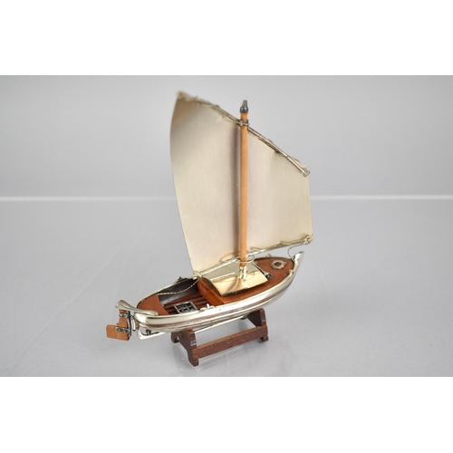 173 - A Silver and Teak Study of a Yacht, Stamped 925, 11cms Wide and 13cms High