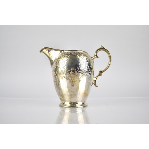 147 - A Victorian Silver and Parcel Gilt Jug by WH, London Hallmark 1843 with Scrolled Handle and Engraved... 