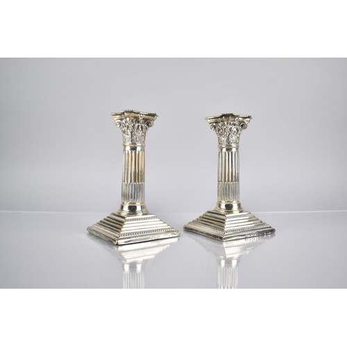 143 - A Pair of Edward VII Silver Corinthian Column Candlesticks by Barker Brothers on Stepped Square Plin... 