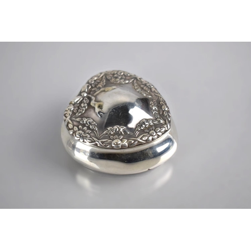 135 - A Silver Heart Shaped Box, The Hinged Lid with Ribbon & Floral Swag Decoration, Birmingham Hallmark,... 