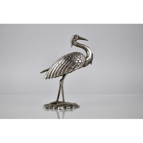 165 - A White Metal Study of a Crane, 11.5cms High