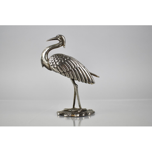 165 - A White Metal Study of a Crane, 11.5cms High