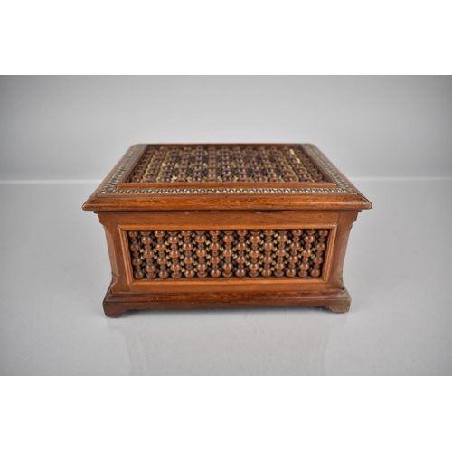 7 - A 19th Century Moorish or Persian Hardwood Box, The Top with Mother Of Pearl Banding, The Sides and ... 