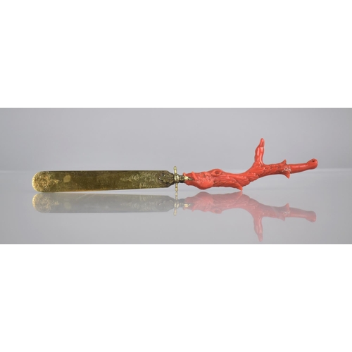 205 - A 19th Century Coral Handled and Unmarked Gilt Metal Page Turner, The Handle of Claw Form incorporat... 