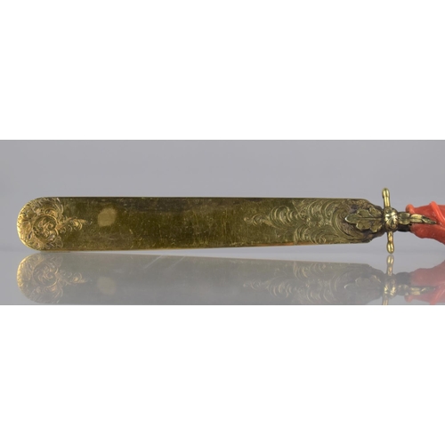 205 - A 19th Century Coral Handled and Unmarked Gilt Metal Page Turner, The Handle of Claw Form incorporat... 