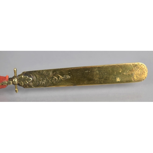 205 - A 19th Century Coral Handled and Unmarked Gilt Metal Page Turner, The Handle of Claw Form incorporat... 