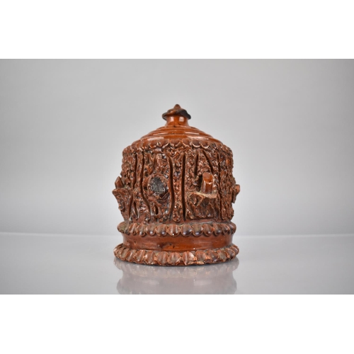 368 - A 19th Century Glazed Pottery Money Box With Faux Bois Decoration. 14cm High