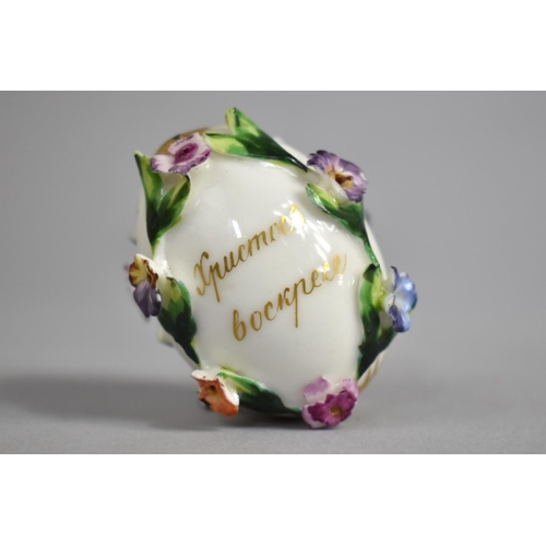 376 - A 19th/20th Century Russian Porcelain Easter Egg with Encrusted Bocage and with Hand Painted Cherub ... 