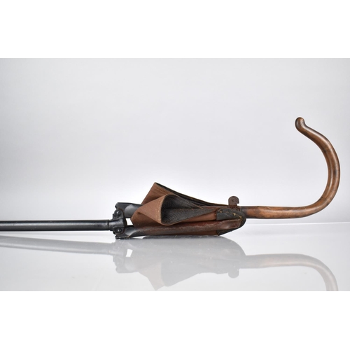 62 - A Late 19th Century German Made Shooting Stick, With a Folding Leather Seat Embossed With Retailers ... 