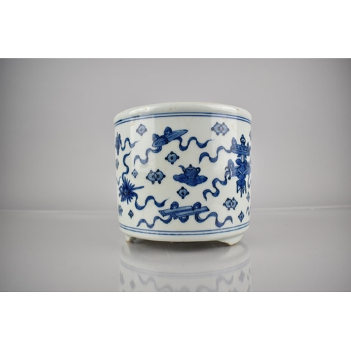 303 - A Chinese Porcelain Blue and White Planter on Short Tripod Supports Decorated with Precious Objects,... 