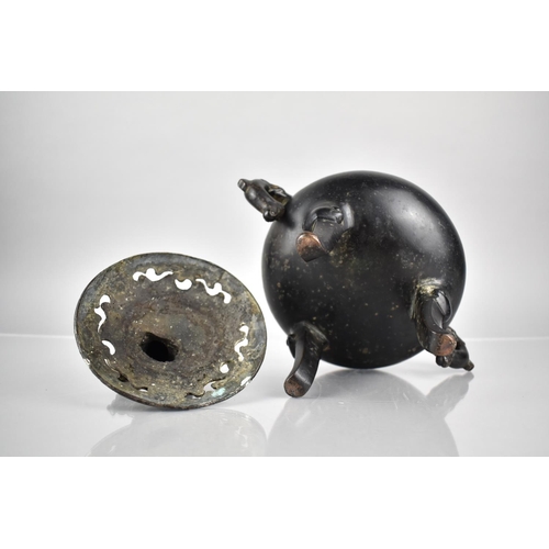 353 - A Chinese Patinated Bronze Tripod Censer and Cover, the Squat Belly with Twin Zoomorphic Handles and... 