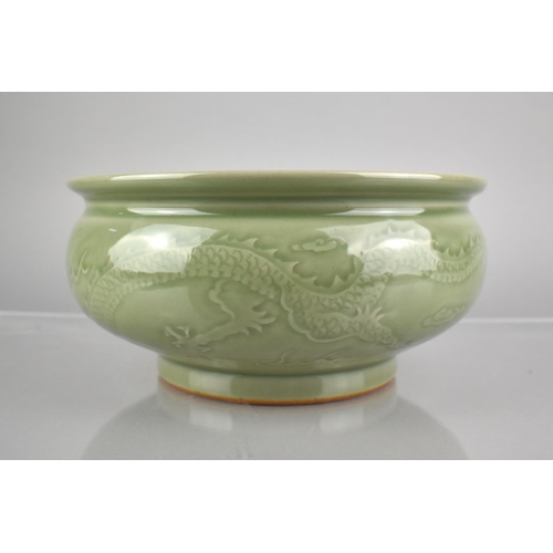 216 - A Chinese Celadon Glaze Censer with Underglaze Dragon Chasing Flaming Pearl, with Lipped Rim and Sho... 