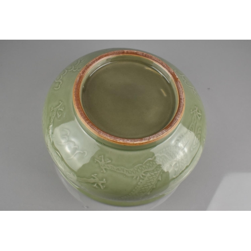 216 - A Chinese Celadon Glaze Censer with Underglaze Dragon Chasing Flaming Pearl, with Lipped Rim and Sho... 