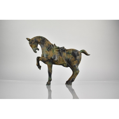 349 - A Chinese Tang Style Cast Patinated Bronze Study of a War Horse, 21cm High