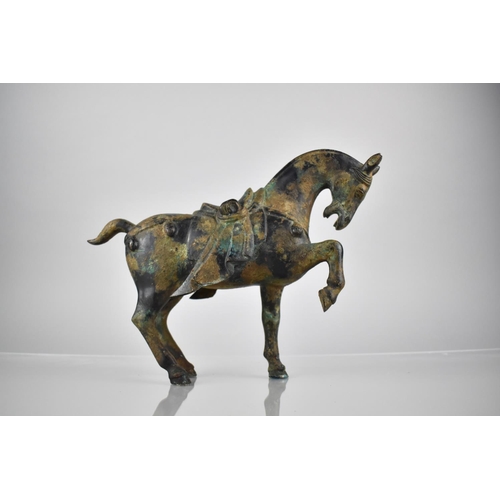 349 - A Chinese Tang Style Cast Patinated Bronze Study of a War Horse, 21cm High