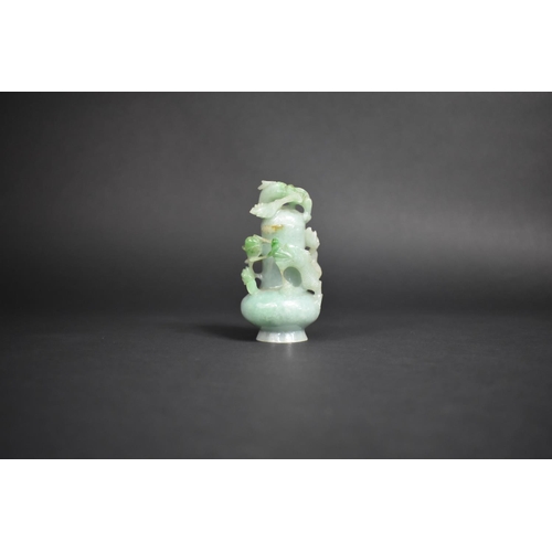 340 - A Jade Bottle Carved in High Relief with Entwined Dragons, 10cm High.