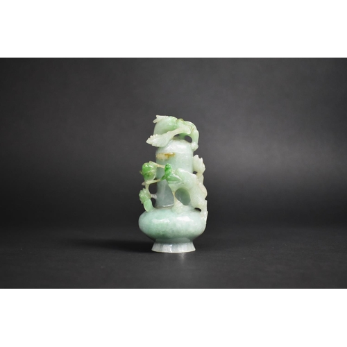 340 - A Jade Bottle Carved in High Relief with Entwined Dragons, 10cm High.