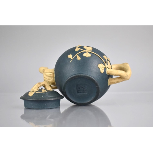 235 - A Chinese Yixing Blue Ground Teapot with Biscuit Stylised Blossoming Branches Handle, Finial and Spo... 