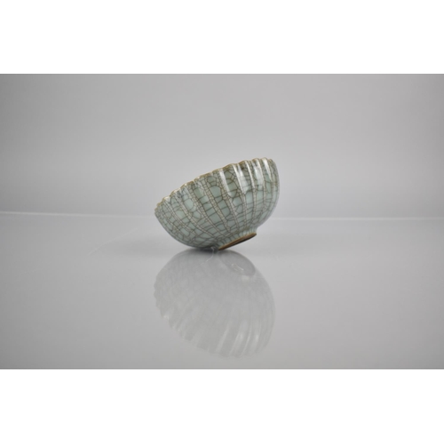 211 - A Chinese Celadon Crackle Glazed Bowl of Lobed Form, 12.5cm Diameter