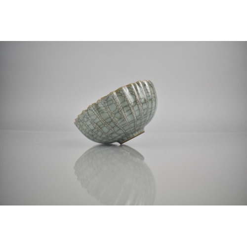 211 - A Chinese Celadon Crackle Glazed Bowl of Lobed Form, 12.5cm Diameter