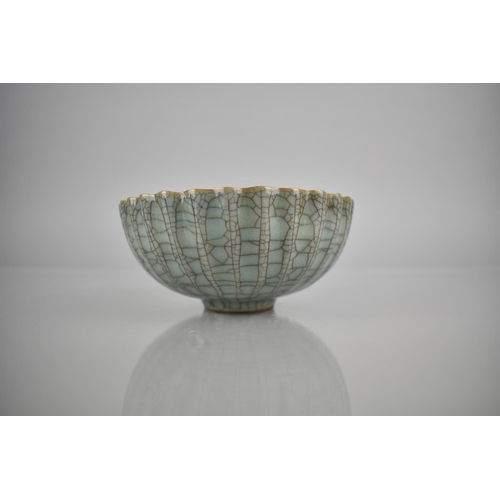 211 - A Chinese Celadon Crackle Glazed Bowl of Lobed Form, 12.5cm Diameter