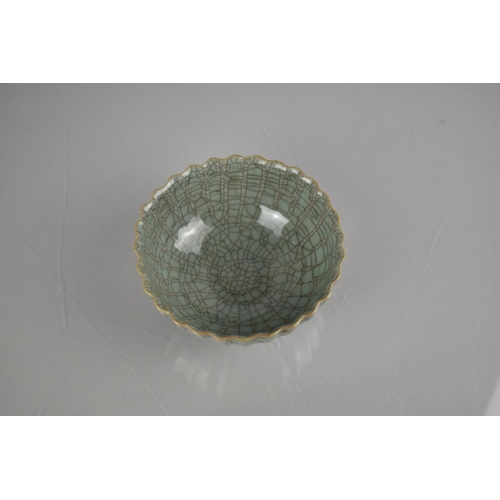 211 - A Chinese Celadon Crackle Glazed Bowl of Lobed Form, 12.5cm Diameter