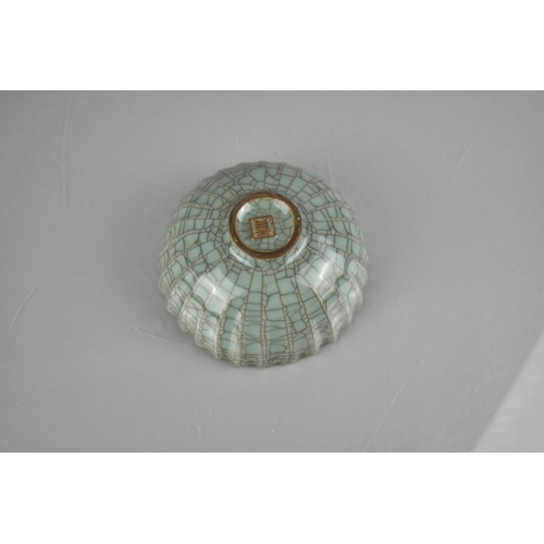211 - A Chinese Celadon Crackle Glazed Bowl of Lobed Form, 12.5cm Diameter