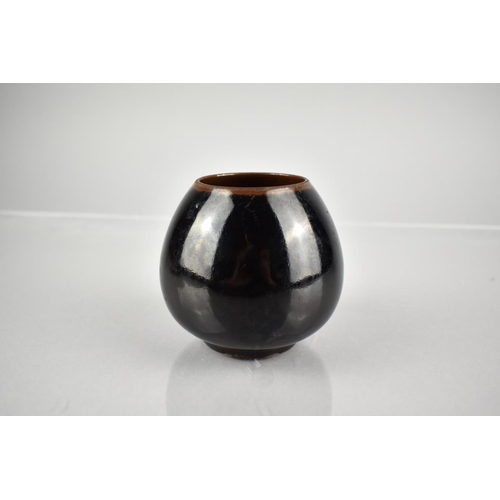 228 - A Chinese Black Glazed Pot of Globular Form, 8cm High